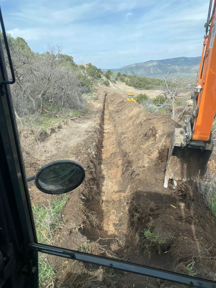Our trenching service efficiently creates precise channels for utilities or drainage on your property, ensuring a clean and safe installation that protects landscaping integrity and enhances overall functionality. for DL Dirtworks LLC in Ephraim, UT