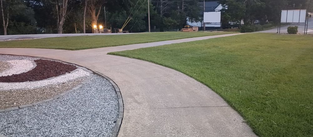 Enhance your yard's curb appeal with our professional edging service, defining clear boundaries between lawn and garden beds while preventing grass encroachment for a clean, polished look that elevates any landscape. for Lindsey's Lawn Care in Inman, SC
