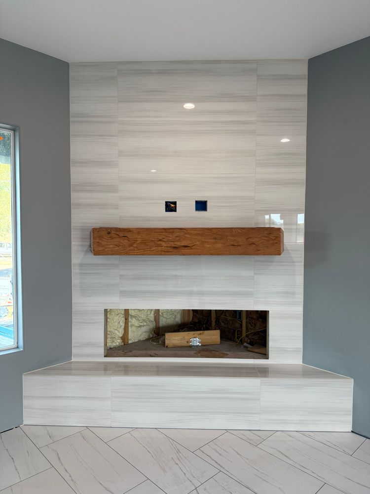 Enhance your home's warmth and elegance with our expert fireplace tiling services. Our skilled team ensures precise installation, transforming your fireplace into a stunning focal point of style and comfort. for C&N Flooring Solutions LLC in Chino Valley, AZ