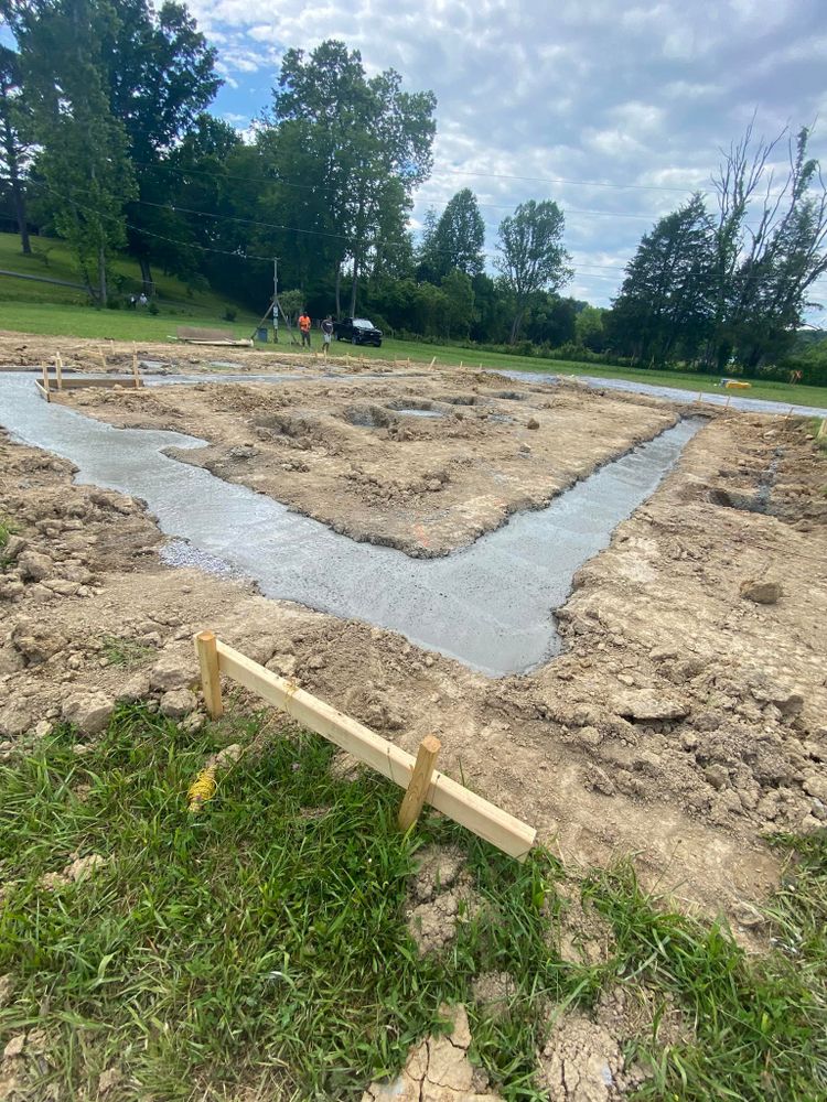 Our Footers service consists of expertly clearing and leveling land to create the foundation for your dream home, ensuring a solid base and optimal drainage for long-lasting construction. for Wilson Quality Construction  in New Tazewell, TN