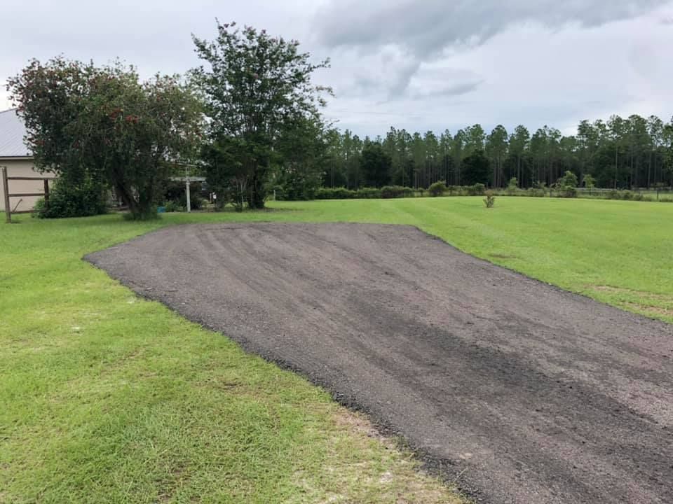 Our Seal Coating service protects your driveway from weather damage, enhances its appearance, and prolongs its lifespan by applying a protective layer that resists water, oil stains, and UV rays. for Lamar Construction in North Central, FL