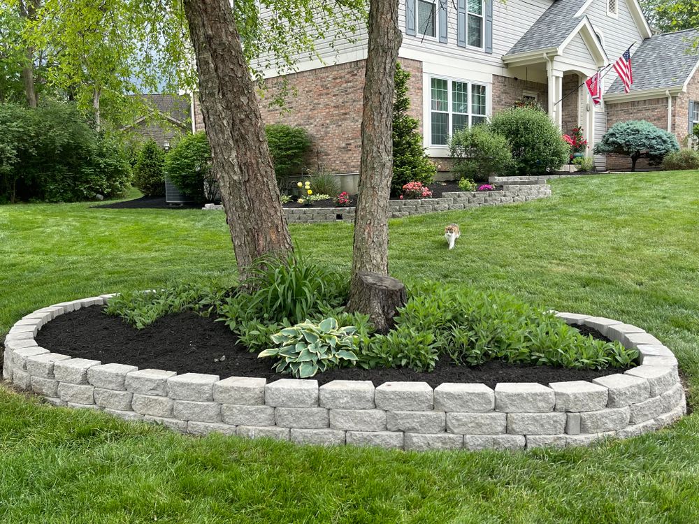 Our Retaining wall service is designed to enhance your property's beauty and functionality, using durable and aesthetically pleasing wall blocks to create structurally sound barriers for landscaping or erosion control. for Woolf Outdoor Services in Mason, OH