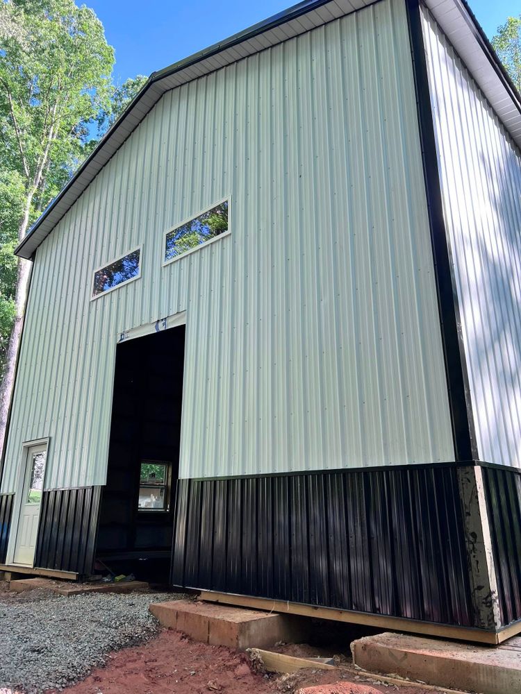Enhance your property with our expert Pole Barn Construction services, delivering durable and versatile structures tailored to your needs. experience quality craftsmanship and personalized solutions for garages, workshops, storage spaces, and more. for Extreme Contractors  in Charlotte, North Carolina