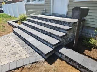 Our professional team provides expert step installation services to enhance the curb appeal and functionality of your home. Trust us to create durable, beautiful steps perfectly tailored to your property's needs. for Lakeside Foundations and Masonry in Garden City, NY