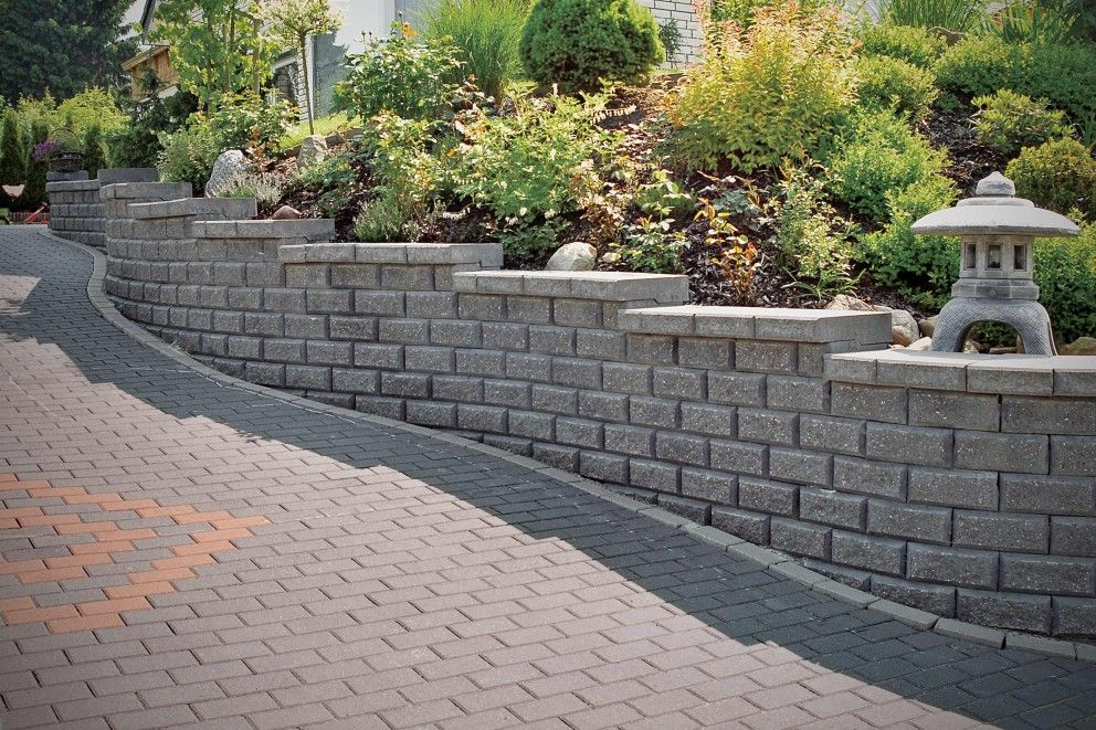 Our Retaining Wall Construction service offers homeowners a reliable and durable solution to prevent soil erosion, create leveled areas, and enhance the overall aesthetics of their landscapes. for Adan landscaping 11 inc in Chicago, IL