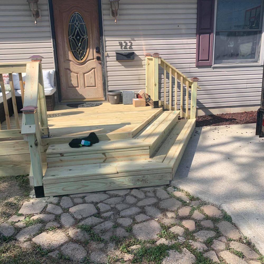 Transform your home's curb appeal with our expert concrete driveway installation service, a perfect complement to our deck & patio installation solutions for beautiful and lasting outdoor spaces. for Erie Builders & Construction in Sandusky, OH