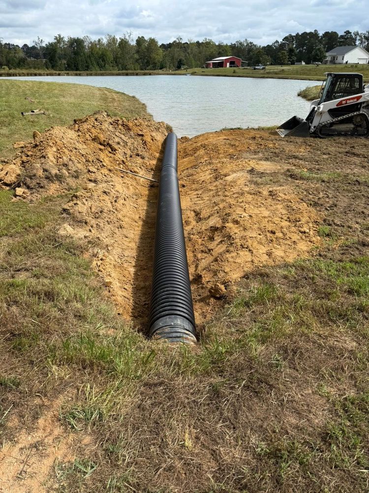 Our Culverts service ensures efficient drainage solutions by expertly installing and maintaining durable culvert systems, protecting your property from water damage while enhancing landscape sustainability and functionality. for Advantage Rental And Services in Youngsville, NC