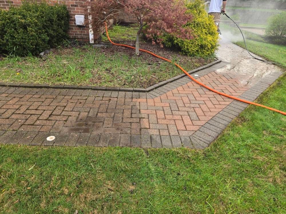 Our Powerwashing service offers thorough pre-paint washing to remove dirt, grime, and mildew, ensuring a clean surface for optimal paint adhesion and a flawless finish on your home exterior. for Rolling Magic Paints in Washington, MI