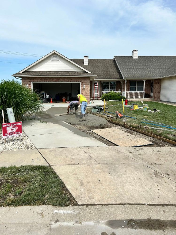 Our Concrete Repair service restores the integrity and appearance of your surfaces by addressing cracks, spalling, and damage, ensuring durability while enhancing the overall look of your home's concrete features. for Snider Concrete in Springfield, IL