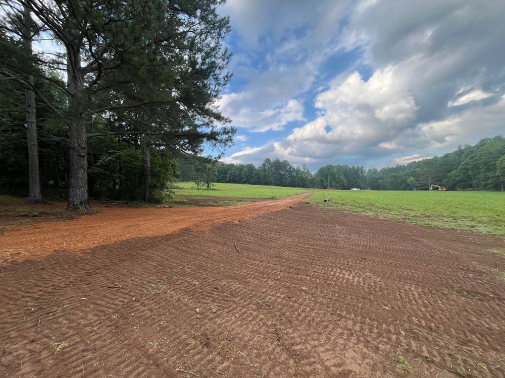 Our Property Grading service ensures your land is properly leveled and sloped for optimal drainage, preventing water damage and enhancing the overall appearance and functionality of your property. for Collins Constructors in Fyffe, AL