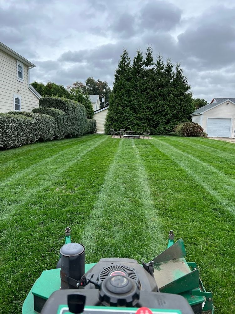 Our professional Lawn Aeration service helps improve soil compaction, allowing better water absorption and root growth for a healthier lawn. Contact us today to revitalize your lawn's health and appearance! for Adens Lawn Maintenance LLC  in Old Lyme, CT