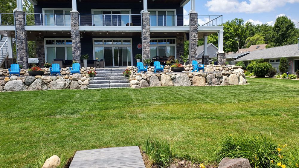 Our professional mowing service ensures your lawn stays healthy, lush, and well-manicured. We provide precise cutting tailored to your landscape's needs, enhancing curb appeal while promoting optimal grass growth and durability. for Michiana Boulders Landscaping & Excavating in Union, MI