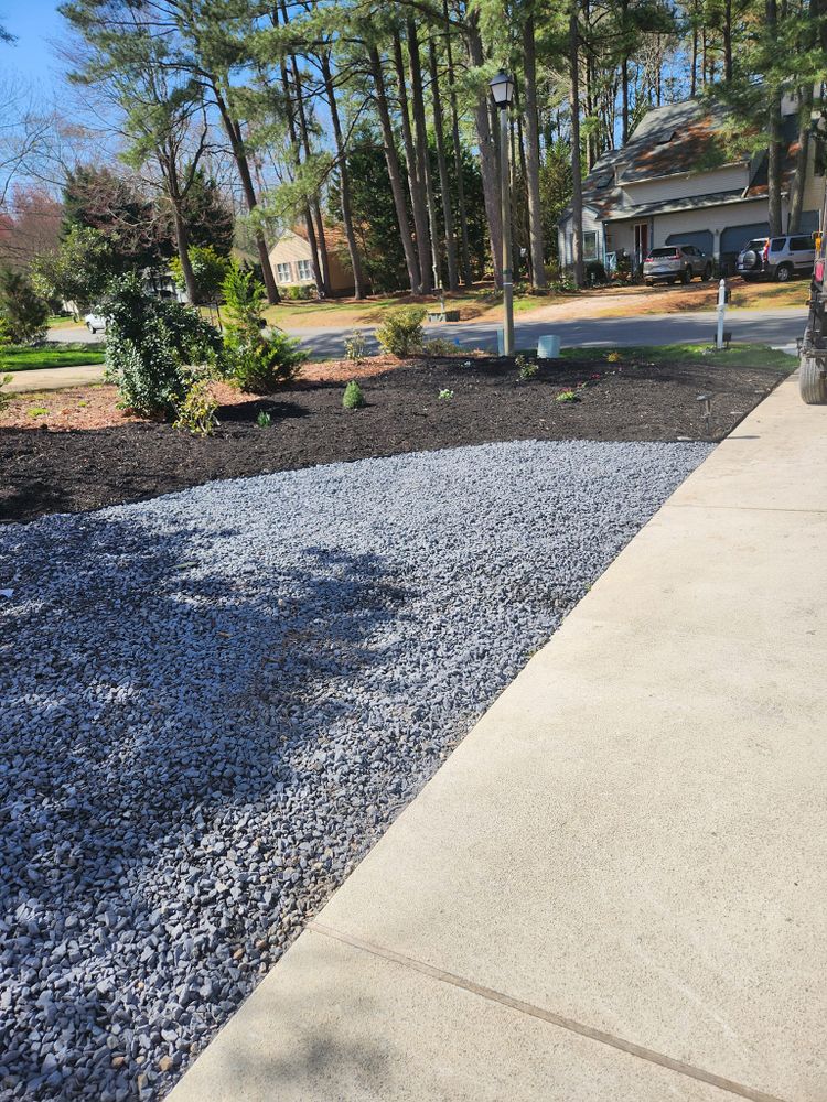 Enhance your outdoor space with our rock installations service by replacing traditional mulch with durable rocks, delivered and installed by our experienced team for a low-maintenance, long-lasting landscaping solution. for Jose's Lawn Care & Tree Service in Williamsburg, VA