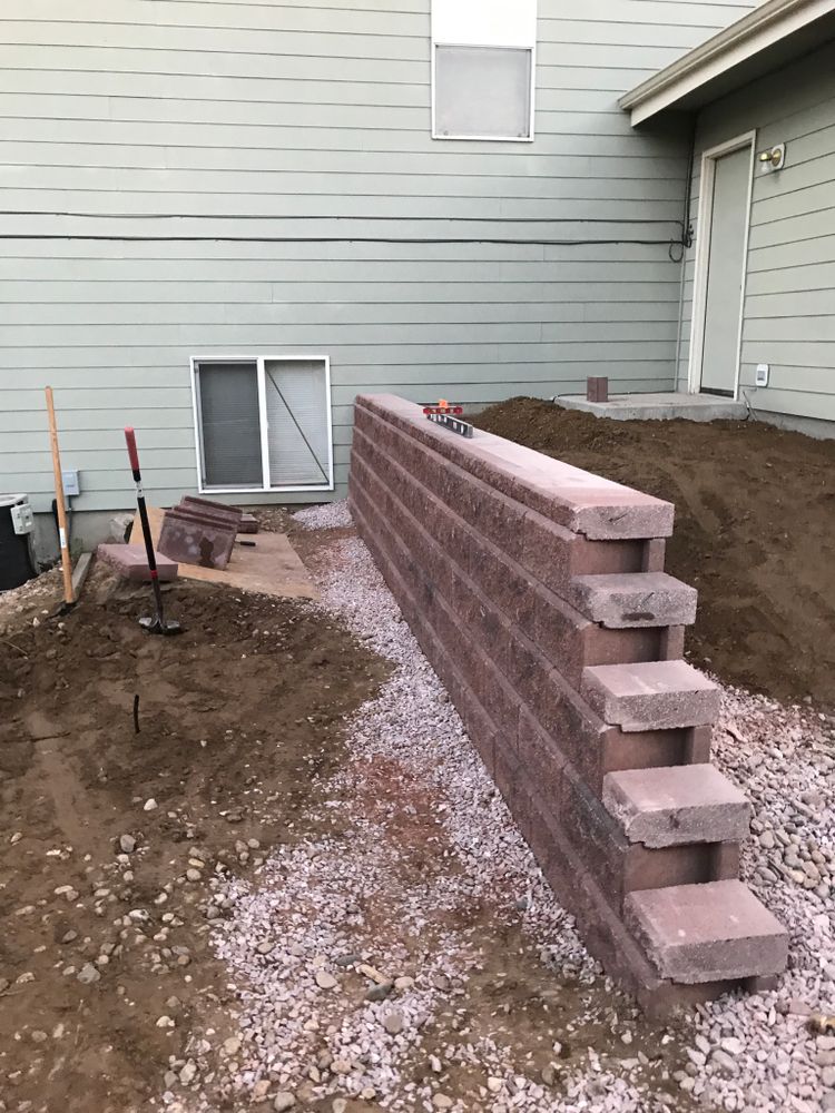 Our retaining wall construction service enhances your landscape's beauty and functionality, preventing soil erosion while adding structural support to your outdoor space for a durable and aesthetically pleasing environment. for Rock Masters Inc. in Evans, CO