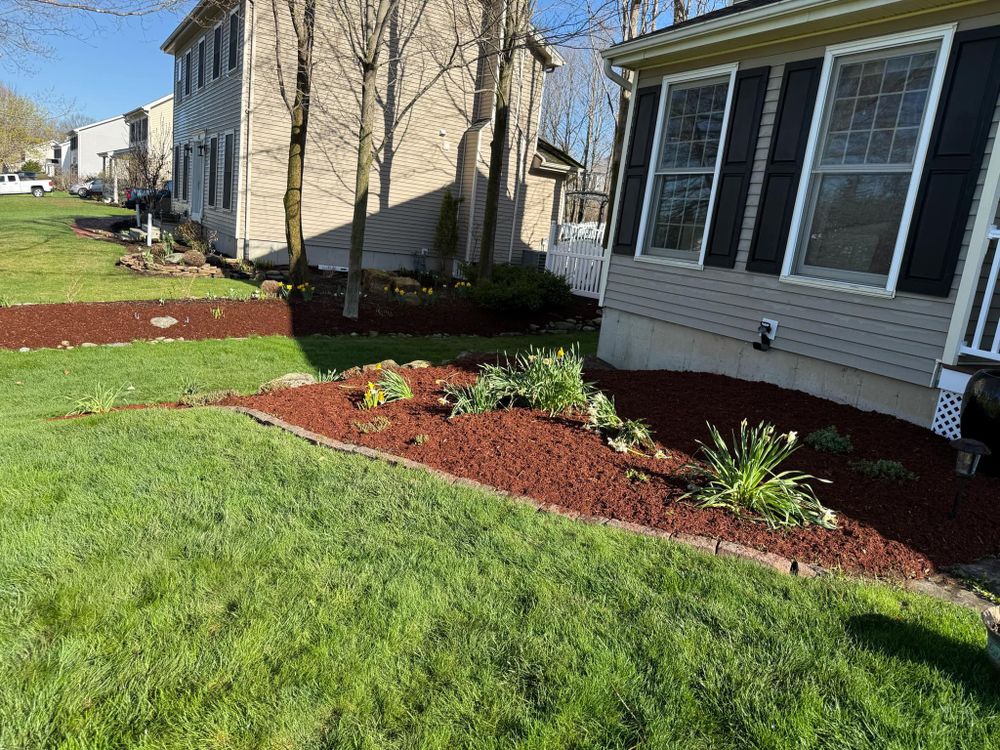 Our Mulch Installation service enhances your landscape’s beauty, helps retain soil moisture, reduces weeds, regulates root temperature, and creates a clean, polished look that supports healthier plants year-round. for Mow N Maintain Property Maintenance in Williston, VT