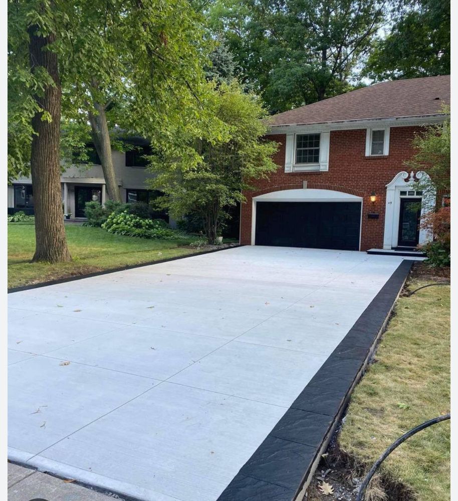 Transform your home's curb appeal with our professional stamped concrete installation service, offering durable and stylish driveways that mimic high-end materials for a fraction of the cost. for Immaculate Concrete and Construction in Troy, IL