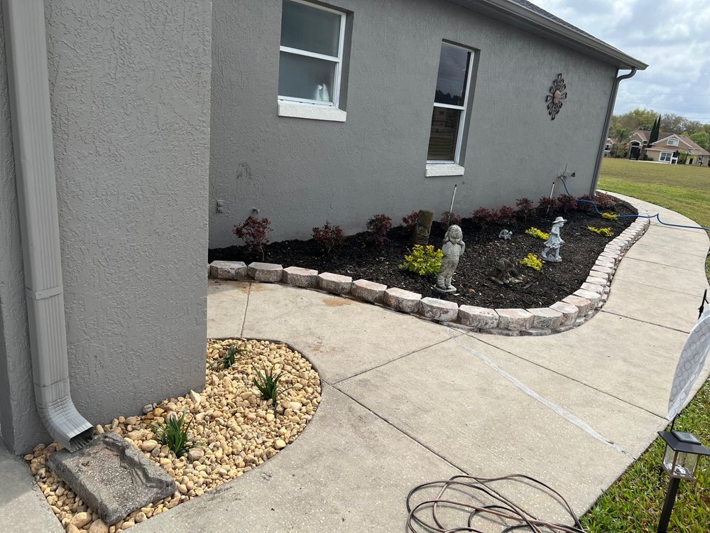 Landscape with retaining wall for Thurmond & Sons Landscaping  in Montverde, FL