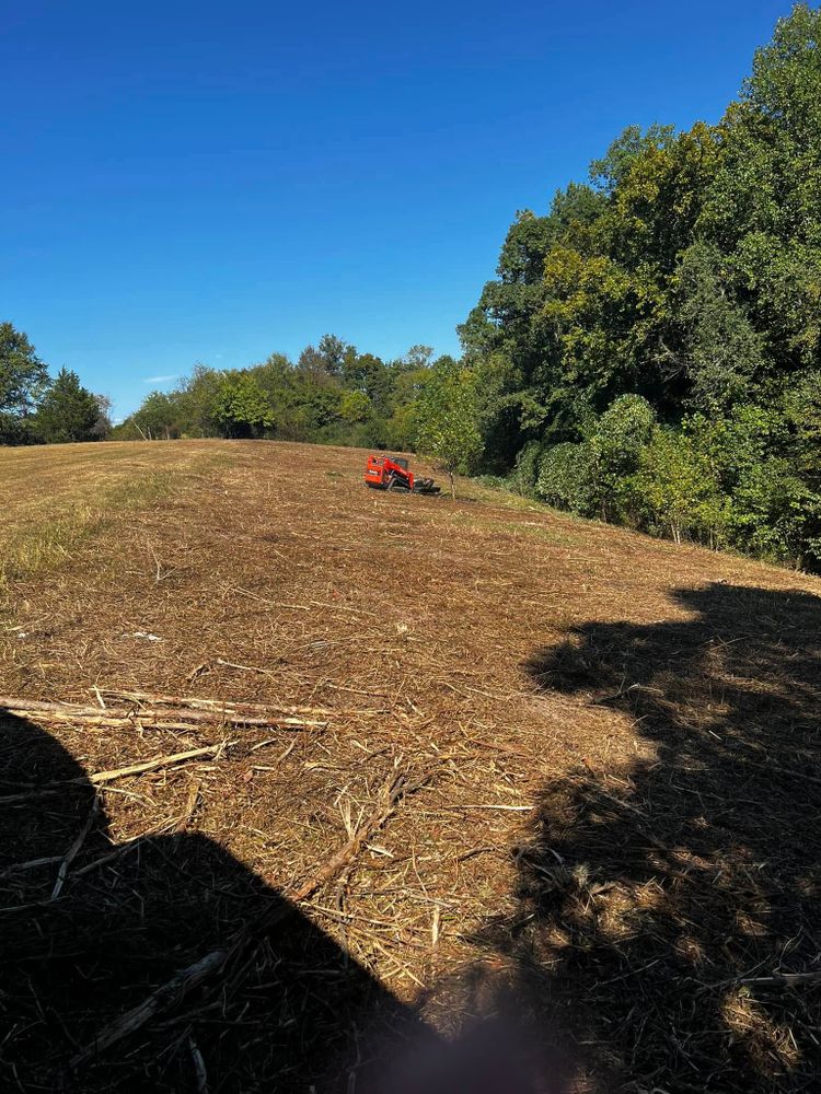 Our Forestry Mulching service efficiently clears land and enhances landscape health through mulch installation, promoting soil enrichment and erosion control while creating a visually appealing environment for homeowners. for Premier Outdoors and Land Management in Baxter, TN