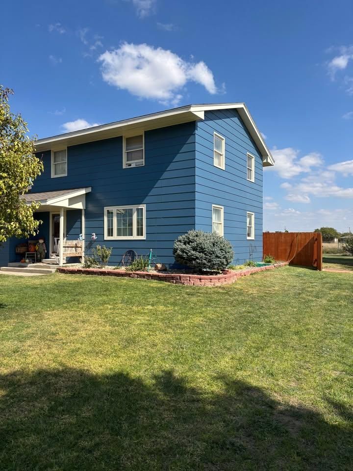 Enhance your home's curb appeal with our expert exterior painting services, seamlessly integrated into our custom home construction solutions to ensure a perfect match with your unique architectural style and personal preferences. for Zimmer Construction & Remodeling in WaKeeney, KS