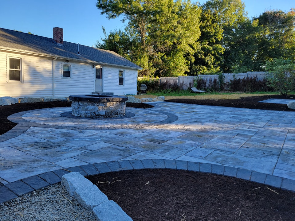 Our custom firepit services create beautiful, durable outdoor gathering spaces that enhance comfort, style, and home value. We design and build hardscapes tailored to your landscape and lifestyle needs. for Casey's Lawn Service LLC in Orono, ME
