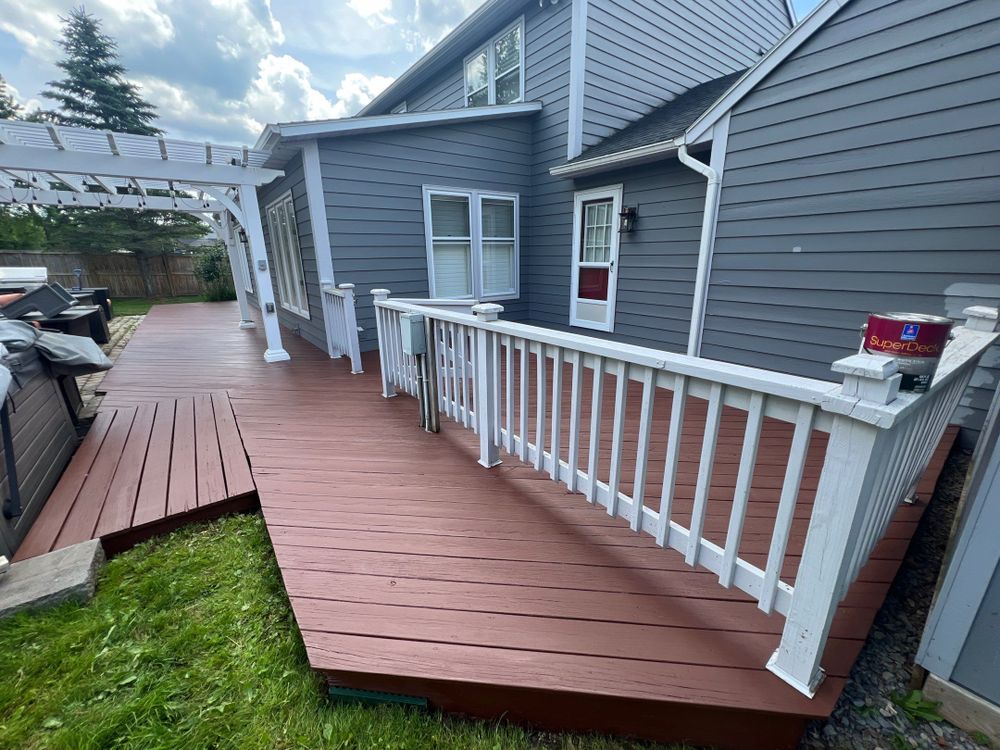 Enhance your deck's beauty and longevity with our expert staining services. Our professionals use top-quality products to protect against weather damage, ensuring a vibrant, durable finish that complements your home’s aesthetic. for Empire Painting Services in Syracuse, NY
