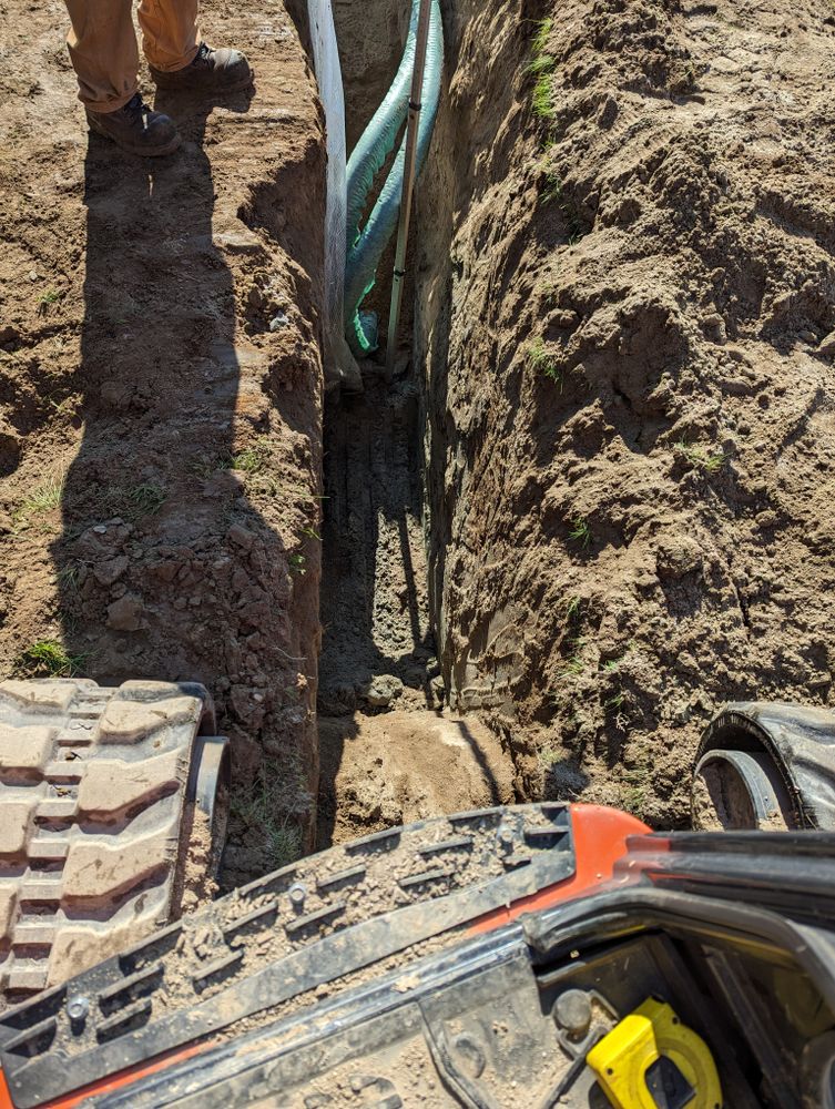 Our trenching and utilities installation service safely digs precise pathways for water, sewer, gas, and electrical lines, ensuring efficient placement, minimal disruption to your property, and reliable infrastructure for new construction. for Krahn Excavation in Oxford County, ME