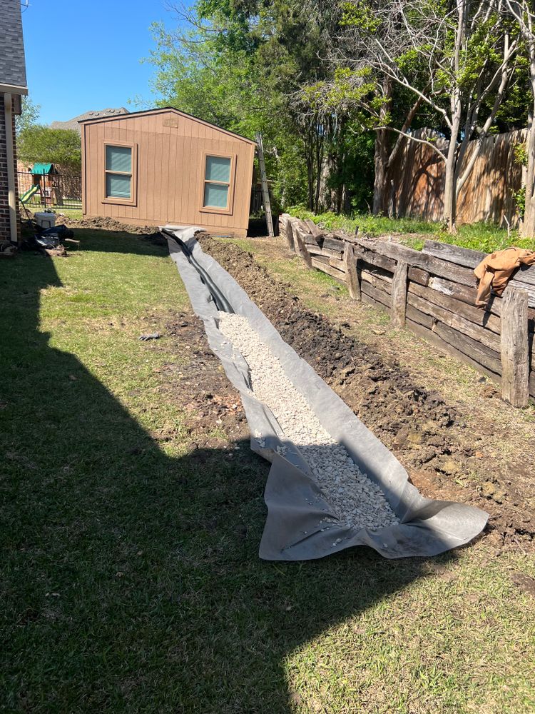 Our drainage service includes expert installation of French drains, effectively managing excess water and preventing erosion. Learn how to French drain your property for optimal landscape protection and drainage solutions. for Pro Grade Services in Rockwall, TX