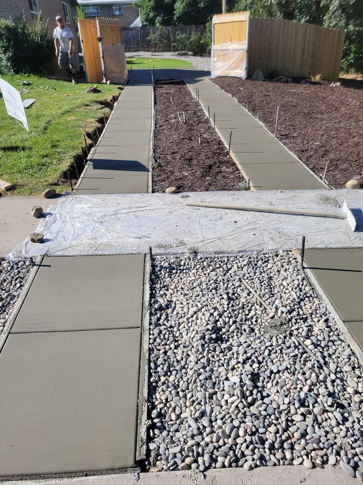 Transform your outdoor space with our expert Sidewalk Installation service. Our team ensures durable, attractive sidewalks that enhance curb appeal and functionality, tailored to complement your home's unique style and needs. for Artisan Concrete in Bluffdale, UT