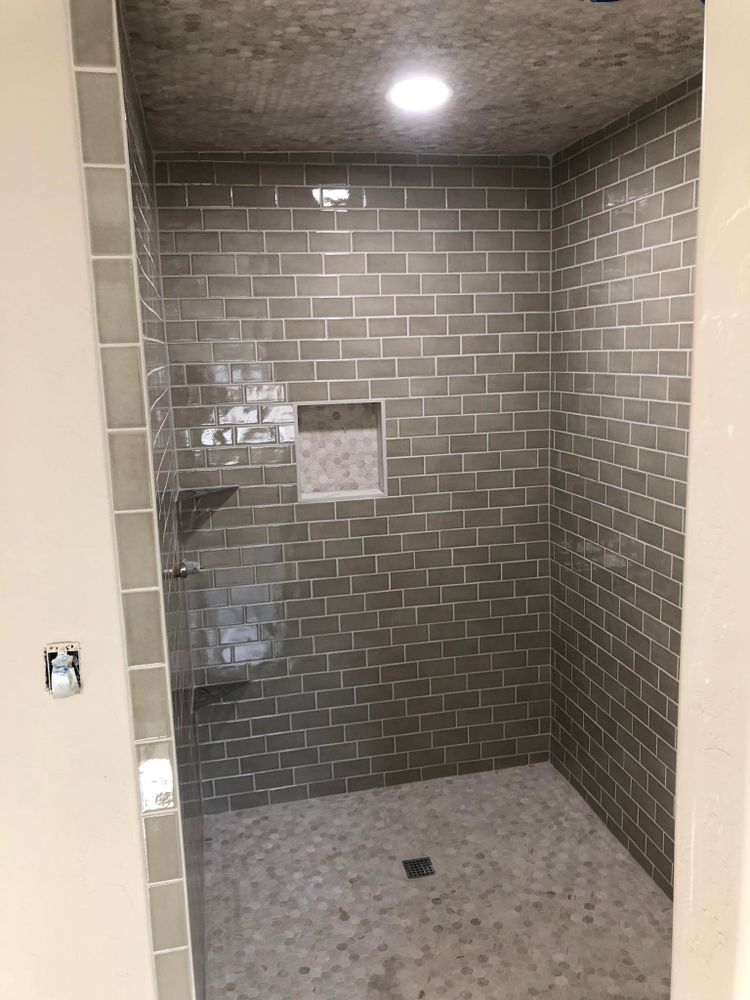 Our professional bathroom tiling installation service offers precise and beautiful results, transforming your space with expert craftsmanship. Rely on us for seamless floor installation that enhances both style and functionality. for Nick's Premium Tile in Oklahoma City, OK