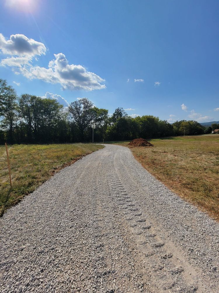 Our Roadbeds service provides homeowners with reliable, durable groundwork for driveways or private roads, ensuring smooth surfaces and enhanced property access through expert excavation techniques tailored to your specific needs. for Troyer's Excavation in Monterey, TN