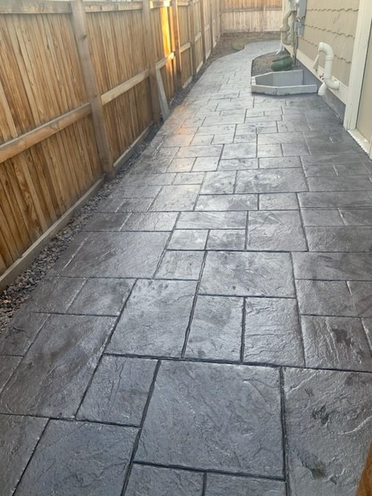 Transform your space with our expert stamped concrete installation, offering durable and visually appealing solutions that mimic natural stone or brick, adding elegance and value to any outdoor area. for 4K Concrete in Aurora, CO