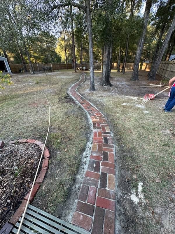 Transform your outdoor space with our expert Walkway & Pathway Construction service, providing durable, aesthetically pleasing paths that enhance accessibility and elevate the beauty of your home’s landscape. for Deeper Roots Landscape in High Springs, FL
