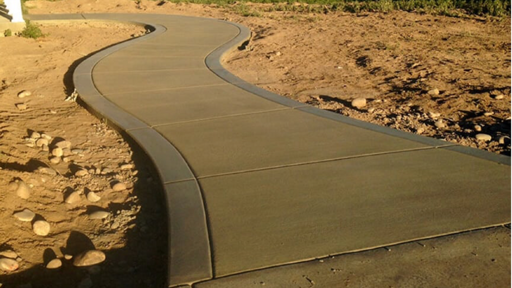 Enhance your home's curb appeal with our expert Sidewalk Installation service. Our skilled team ensures durable and aesthetically pleasing pathways that seamlessly blend with your landscape for a perfect outdoor experience. for Providence Concrete, LLC in Murfreesboro, Tennessee