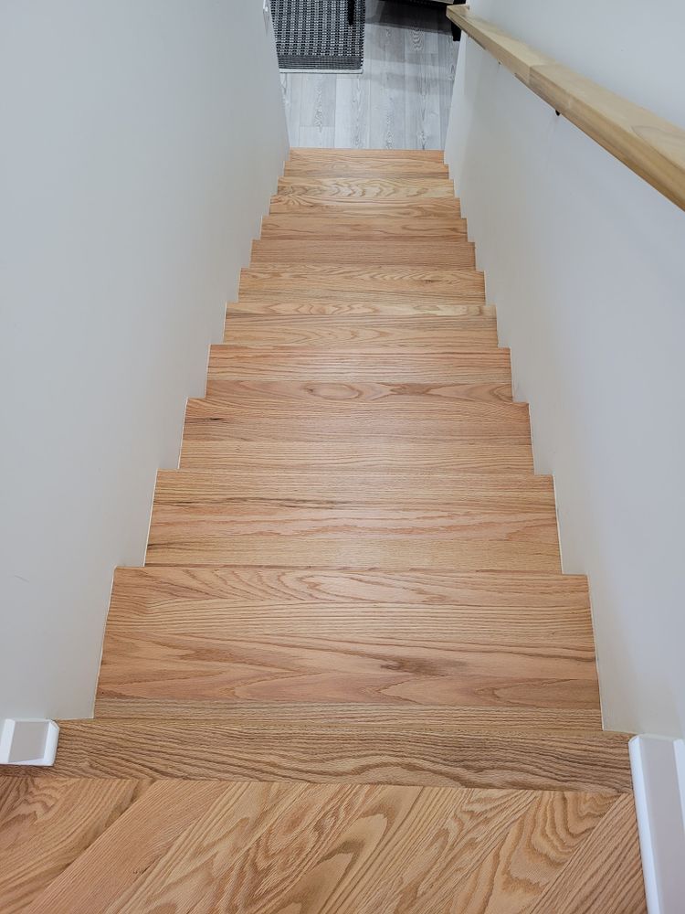 Our Stairs service offers expert installation and renovation solutions to seamlessly integrate your staircase with our high-quality flooring options, enhancing the overall aesthetic appeal of your home. for AVance Flooring in Bridgman, MI