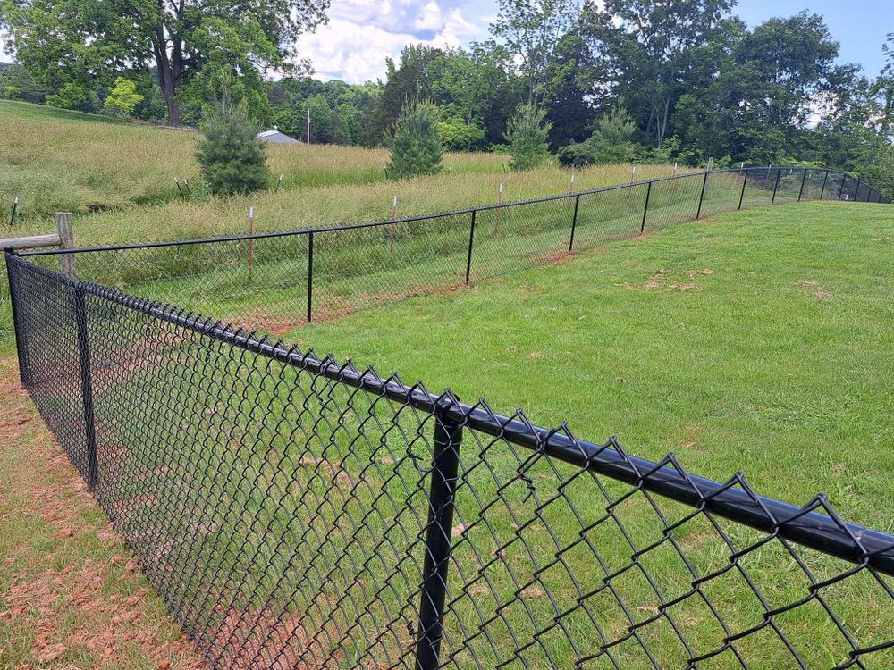 Our Chain Link service offers durable and affordable fencing options for homeowners seeking a secure boundary around their property, with customizable styles to fit any design preference. for Southern Town & Country Fence in Sparta, TN