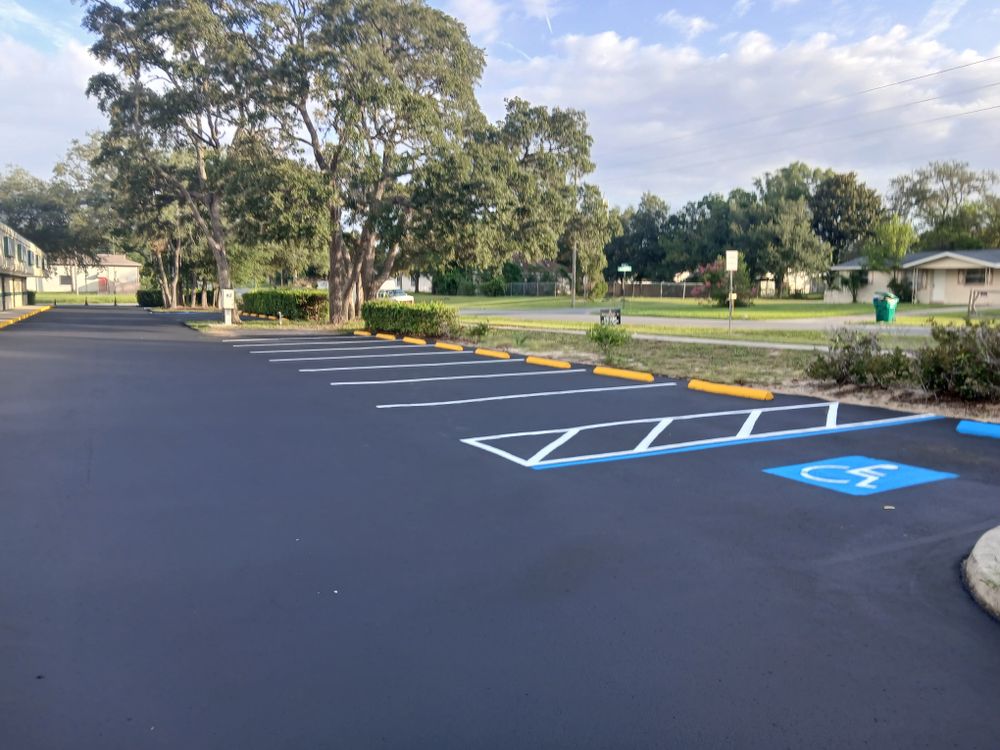 Enhance your asphalt's durability and appearance with our Commercial Seal Coat Protective Coatings. Our service extends pavement life by protecting against weather, UV damage, and wear, ensuring a pristine surface for years. for Karas Parking Lot Services LLC in Hernando County, FL