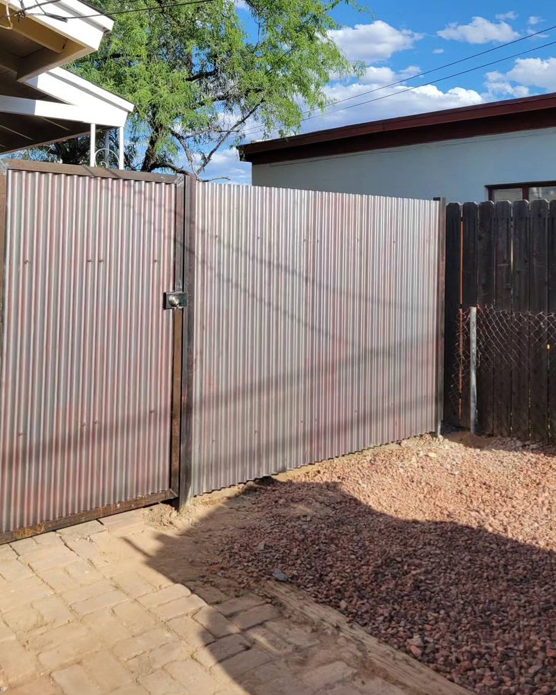 Our Gate Installation and Repair service ensures seamless functionality, security, and enhanced aesthetic appeal to your property's entrance with our expert craftsmanship. for Az Corrugated Fencing   in Tuscon Estates, AZ