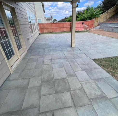 Our stamped concrete service creates durable, decorative surfaces that mimic stone, brick, or tile, enhancing patios, driveways, and walkways with lasting beauty, low maintenance requirements, and customized patterns fit. for Adams Reconstruction in Clayton, NC