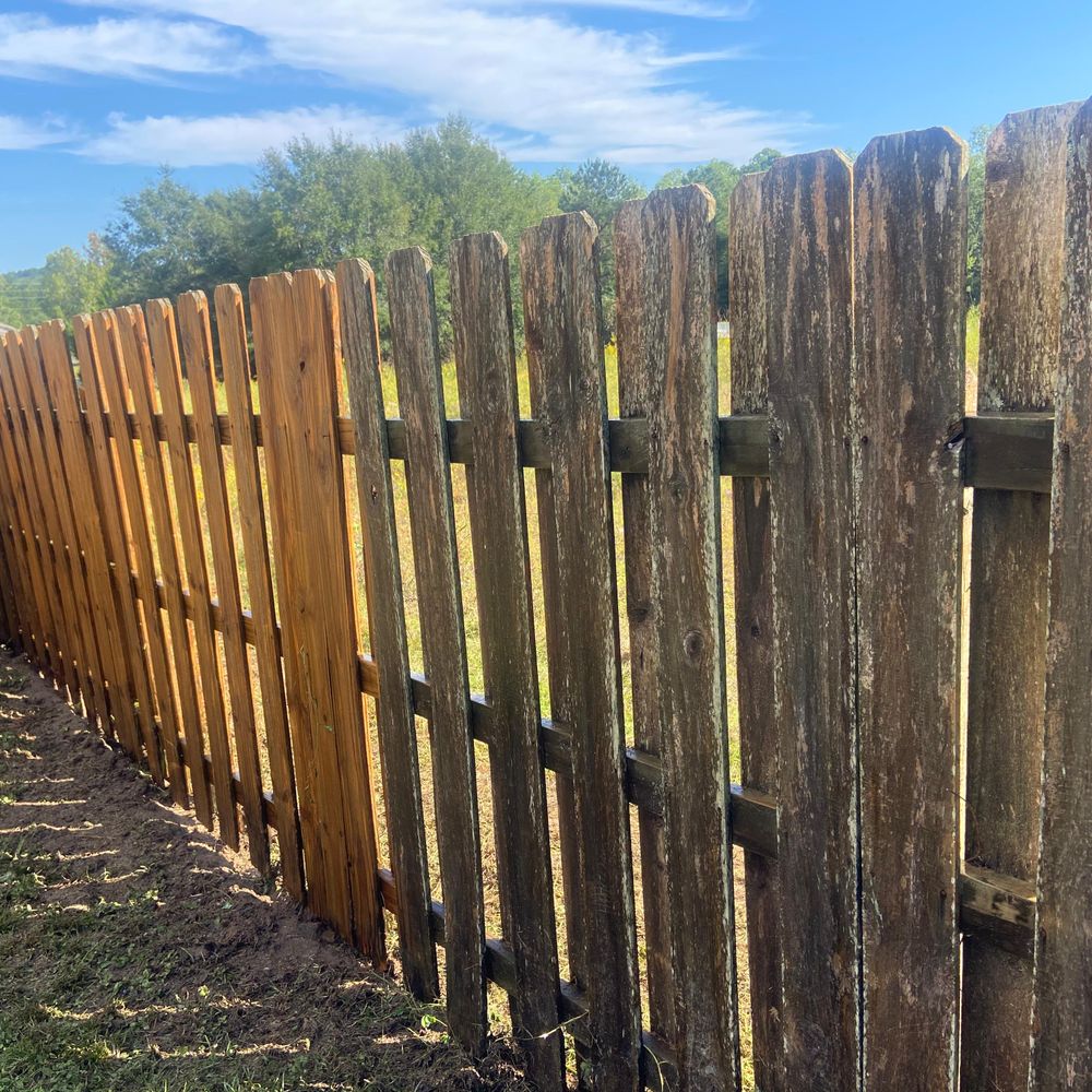 Our Fence Washing service effectively removes dirt, grime, and mold from your fence using high-pressure water cleaning techniques to restore its original beauty and prolong its lifespan. for Panhandle Exterior Pros LLC in Milton, FL