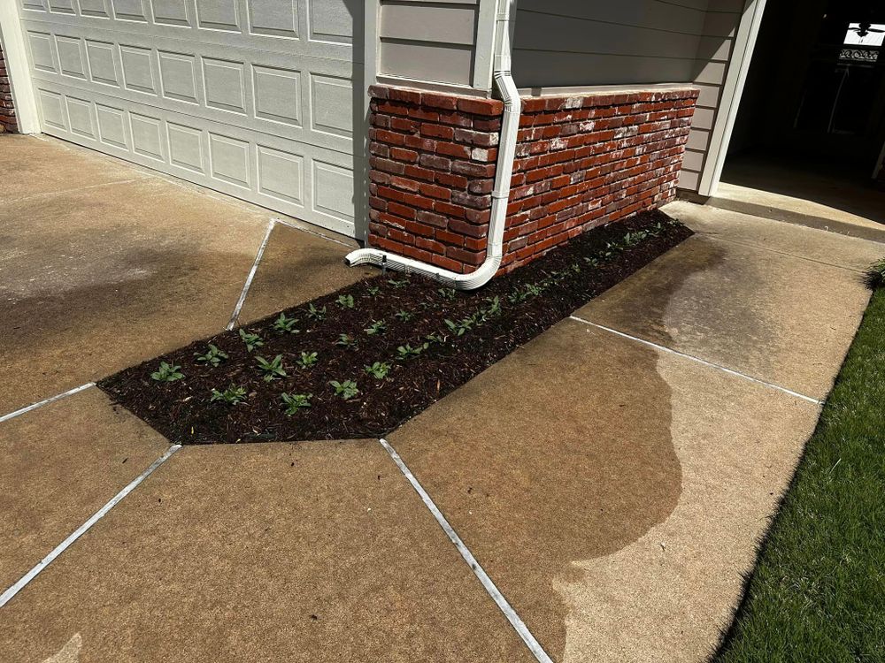 Our Mulch Installation service provides an easy and cost-effective way to improve the appearance of your landscape while also helping to retain moisture, reduce weed growth, and protect plant roots. for Lawn Dogs Outdoors Services in Sand Springs, OK
