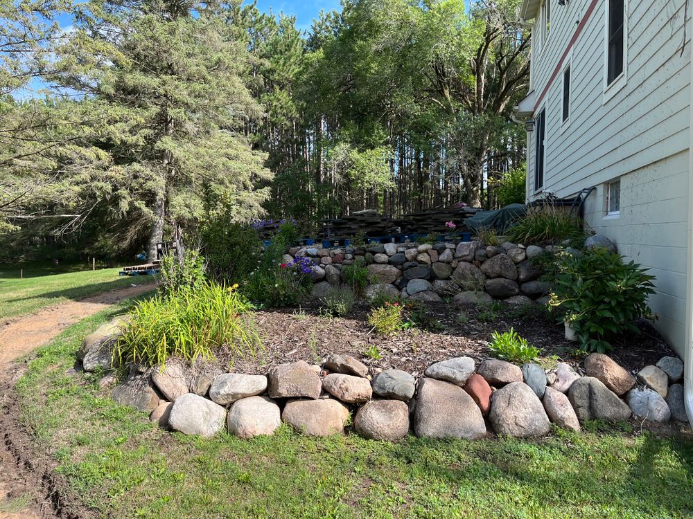 Enhance your landscape and conserve moisture with our Mulch Installation service. Our team will professionally install high-quality mulch to improve the appearance and health of your garden beds. for Jobsite Buddy in Stacy, MN