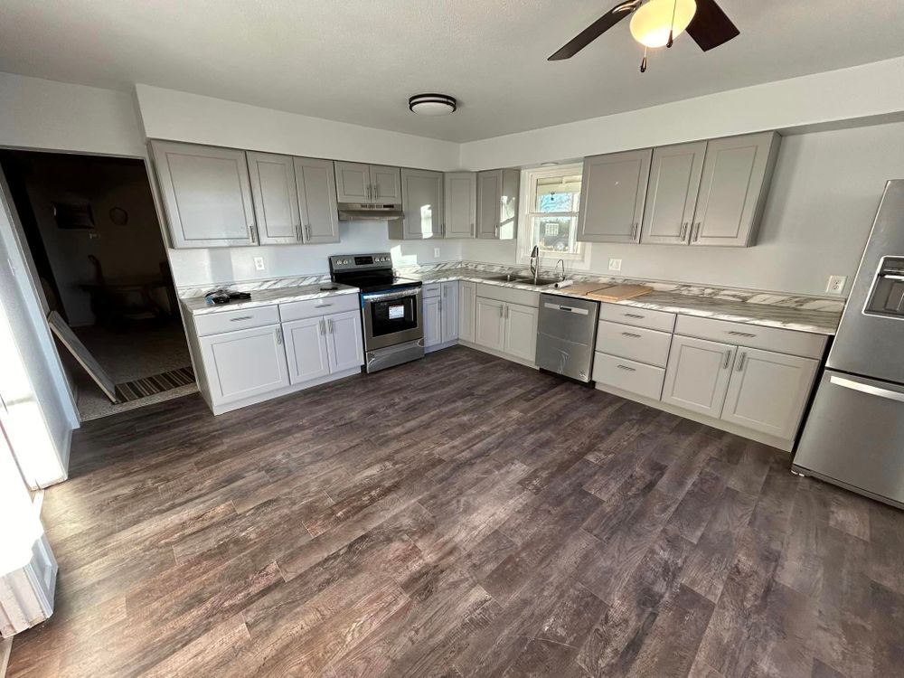 Our Kitchen Renovation service will transform your outdated kitchen into a modern and functional space with new countertops, cabinets, flooring, and appliances. Let us create the kitchen of your dreams! for DZ Construction in Lamar, CO