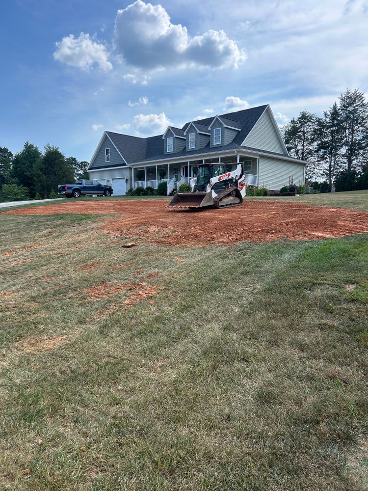 Our Grading service ensures your outdoor space is level and properly prepared for landscaping projects, creating a solid foundation for beautiful gardens, pathways, retaining walls, and more. for Cook's Lawn & Landscaping in Taylorsville, NC