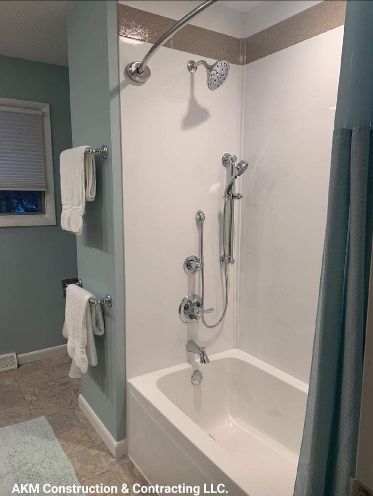 Transform your bathroom into a luxurious retreat with our expert renovation service. From modern upgrades to complete remodels, we bring style and functionality to your space with top-quality materials and craftsmanship. for AKM Construction & Contracting in Ely, IA