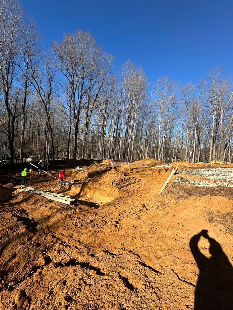 Our professional Trenching service offers precise and efficient digging for various needs such as installing utilities, drainage systems, or foundation footings on your property with minimal disruption. for Herbert Excavating in Hughesville, MD