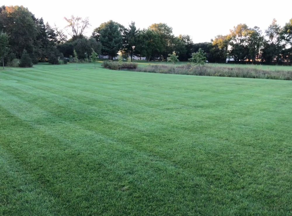 Our professional mowing service ensures a pristine lawn with precise trimming, edging, and clean-up, enhancing your yard's aesthetics while promoting healthy grass growth for a lush and vibrant outdoor space. for TCB Lawn Care & Snow Removal in Sun Prairie, WI