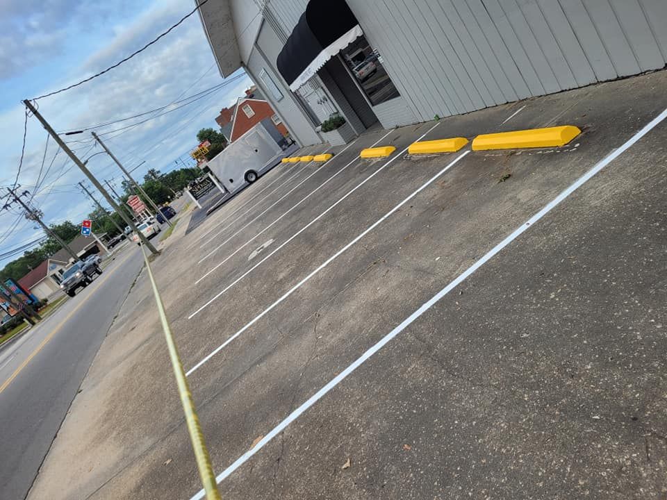 Our Curbing service enhances the beauty and functionality of your property by providing durable, stylish borders for your asphalt surfaces. Elevate your outdoor space with our professional curbing solutions. for Southeast Sealing & Striping in Bladenboro, NC