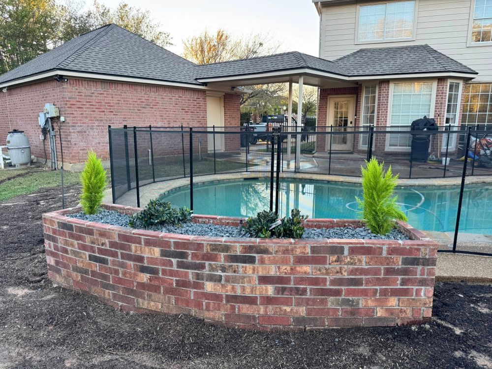 Our stone work service enhances your landscape with durable walkways, retaining walls, patios, and borders that complement your trees, improve drainage, boost curb appeal, and create beautiful outdoor spaces. for Year Round Trees & Concrete Inc. in Fort Worth, TX