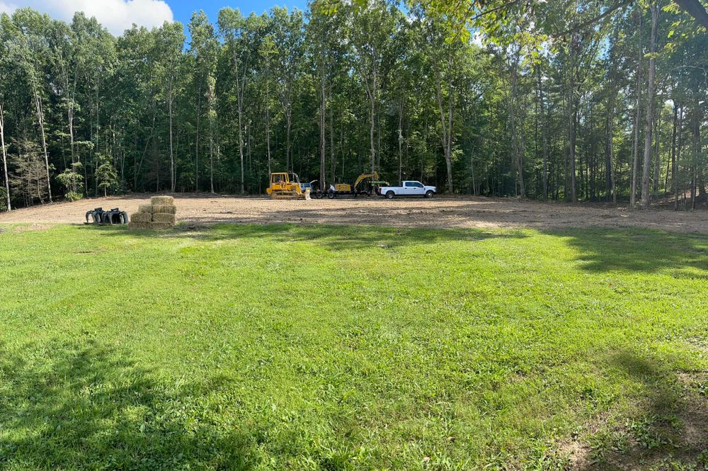 Our House Pads service provides expertly leveled and compacted foundations, ensuring your new home is built on a stable, durable base designed with precision to withstand time and weather conditions efficiently. for Mountain Land Services LLC. in Oneida, TN