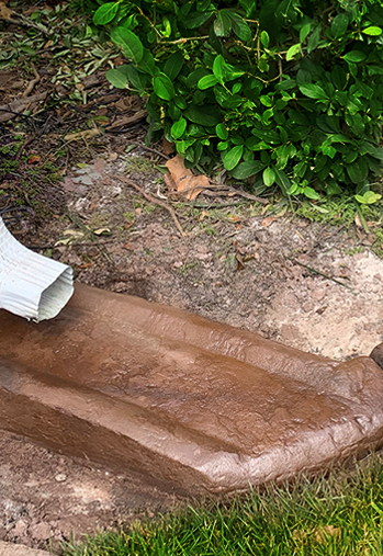 Say goodbye to flimsy plastic being blown away by the wind. We create custom downspout troughs, guiding water efficiently from the spout to the curb. for AL Curbs in Cape Coral, FL